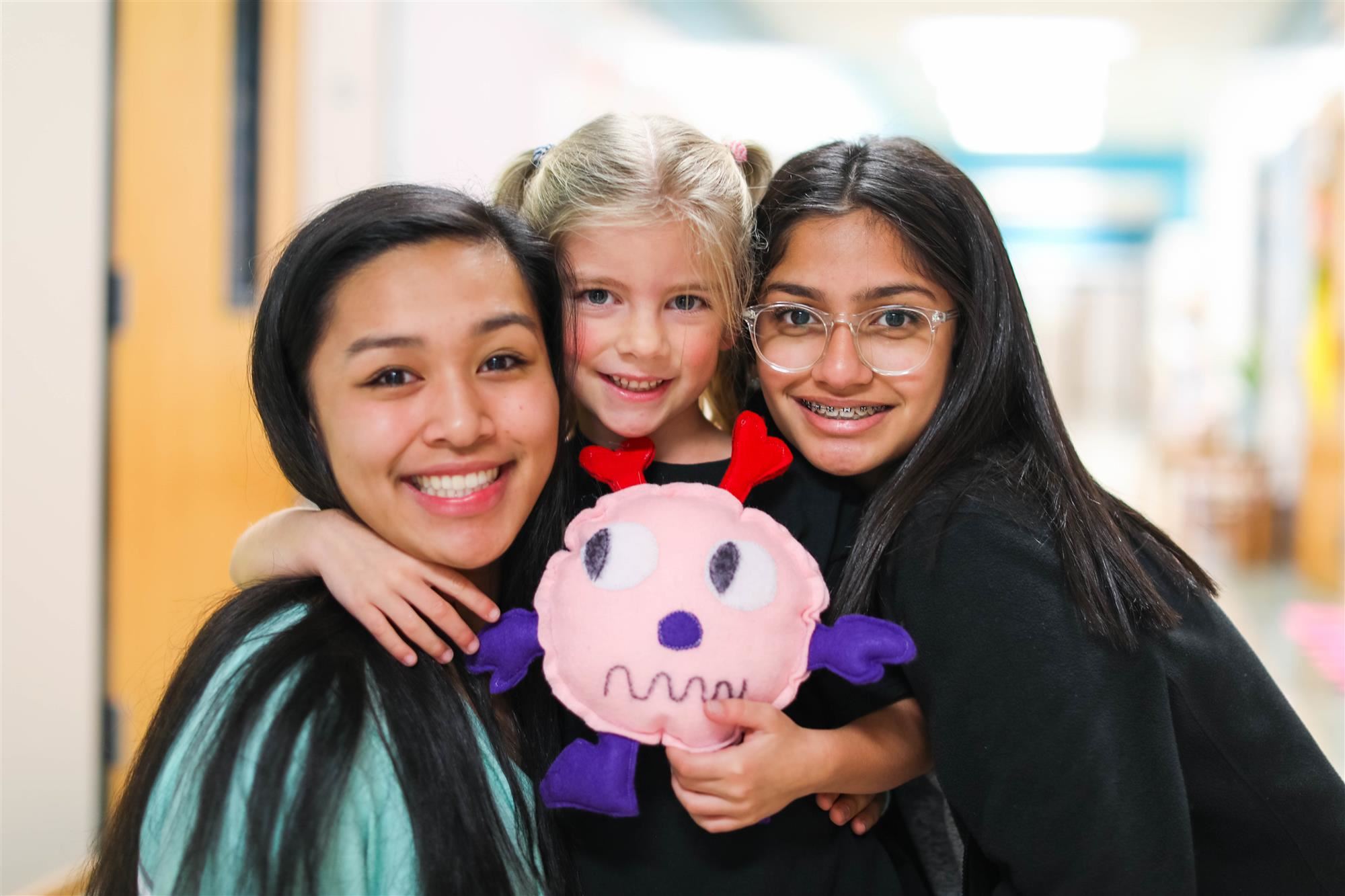 Creek Valley students pose with Hebron Valley student and her new stuffed monster friend. 2019 