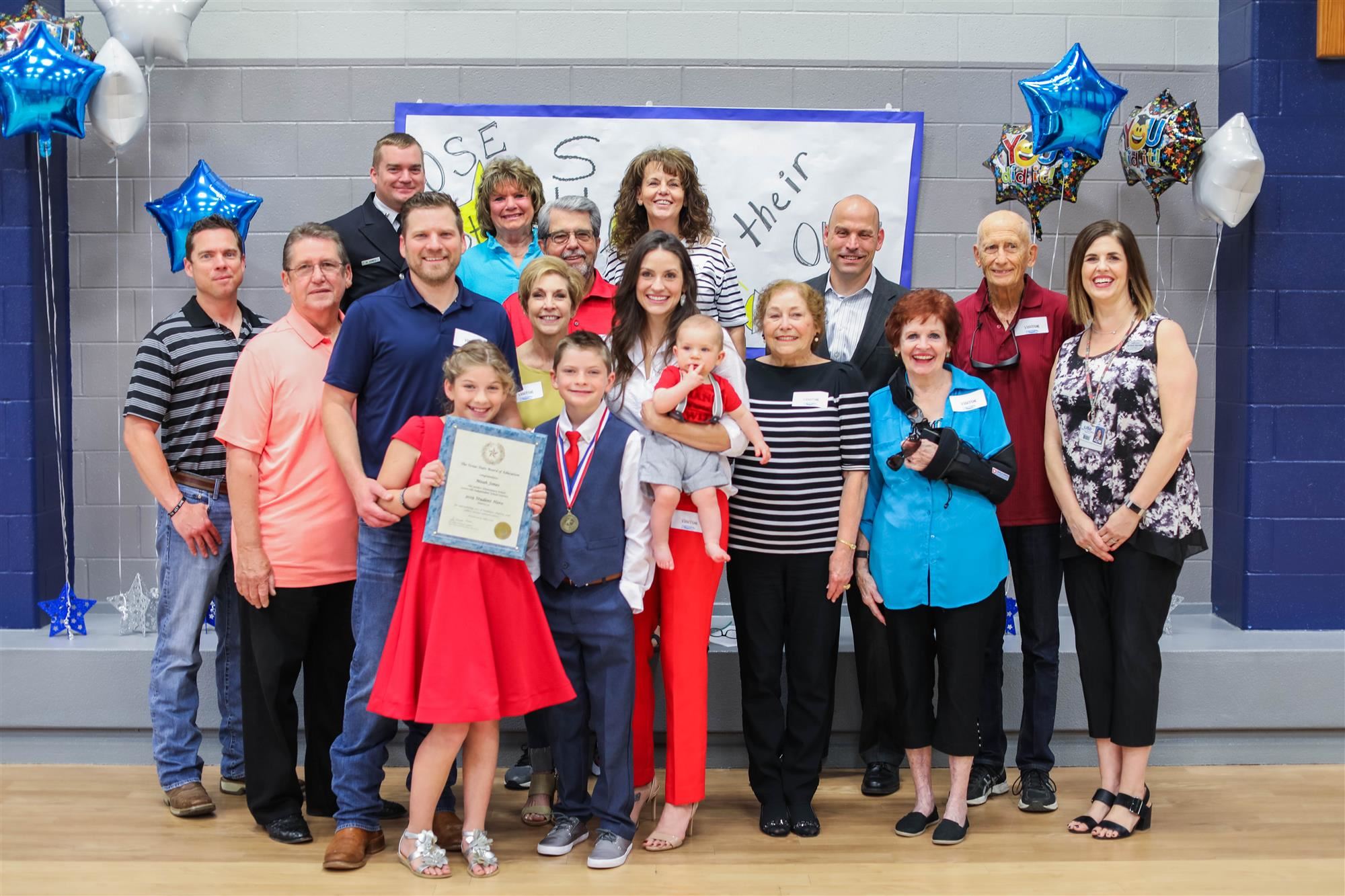 Meah Jones and family with Meah's Texas State Board of Education Award. 