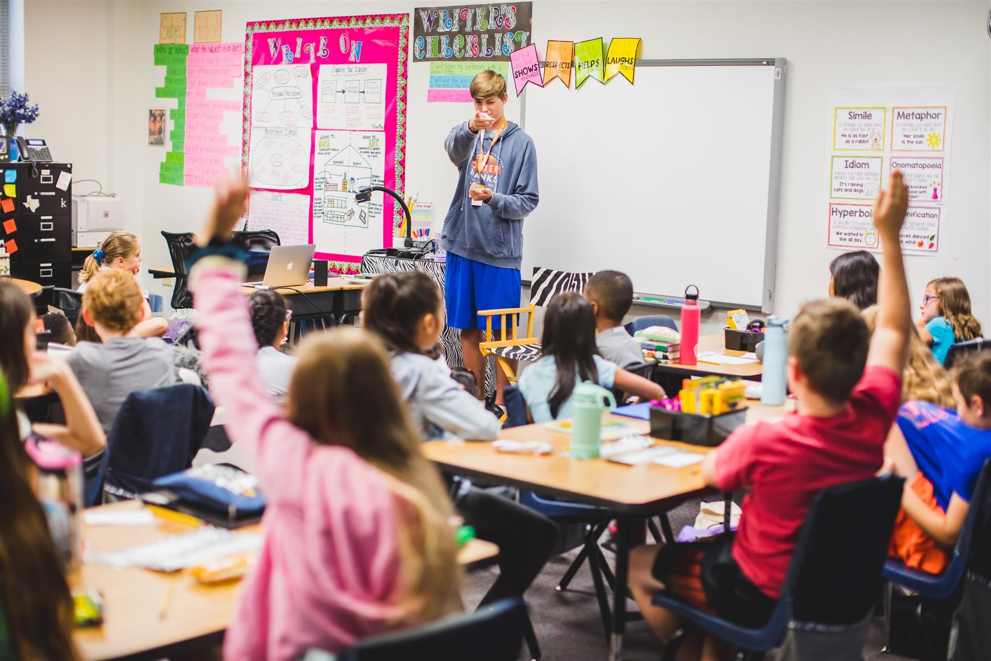 Isaac Littleton points to a Bluebonnet Elementary student to answer their question.  