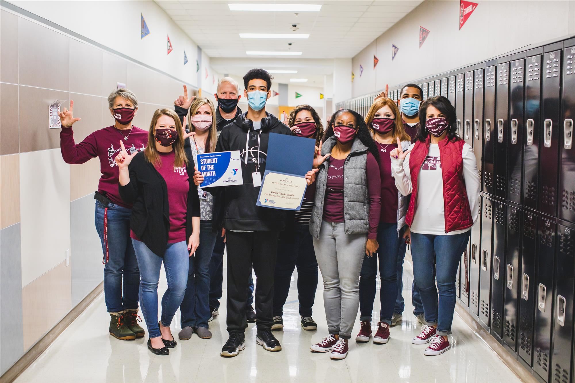 LHS Harmon Sophomore Carlos Plazola Castillo accepts Lewisville Chamber December Student of the Month Award. 