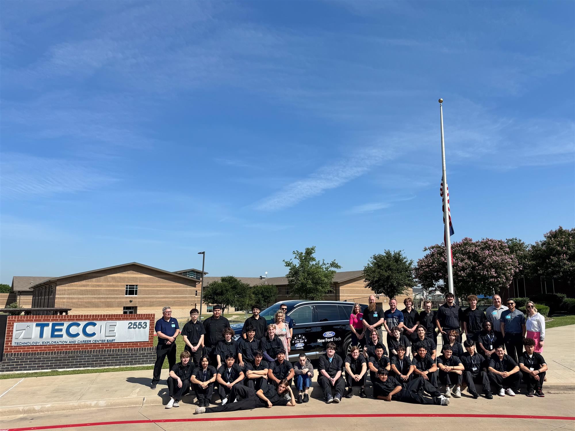 TECC-East students and staff accept vehicle donation from Five Star Ford Lewisville. May 2024