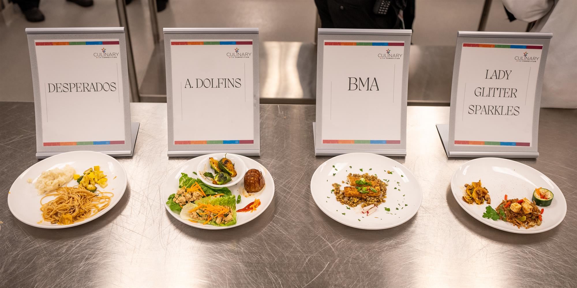 The dishes of the four competing teams are presented to the panel of judges