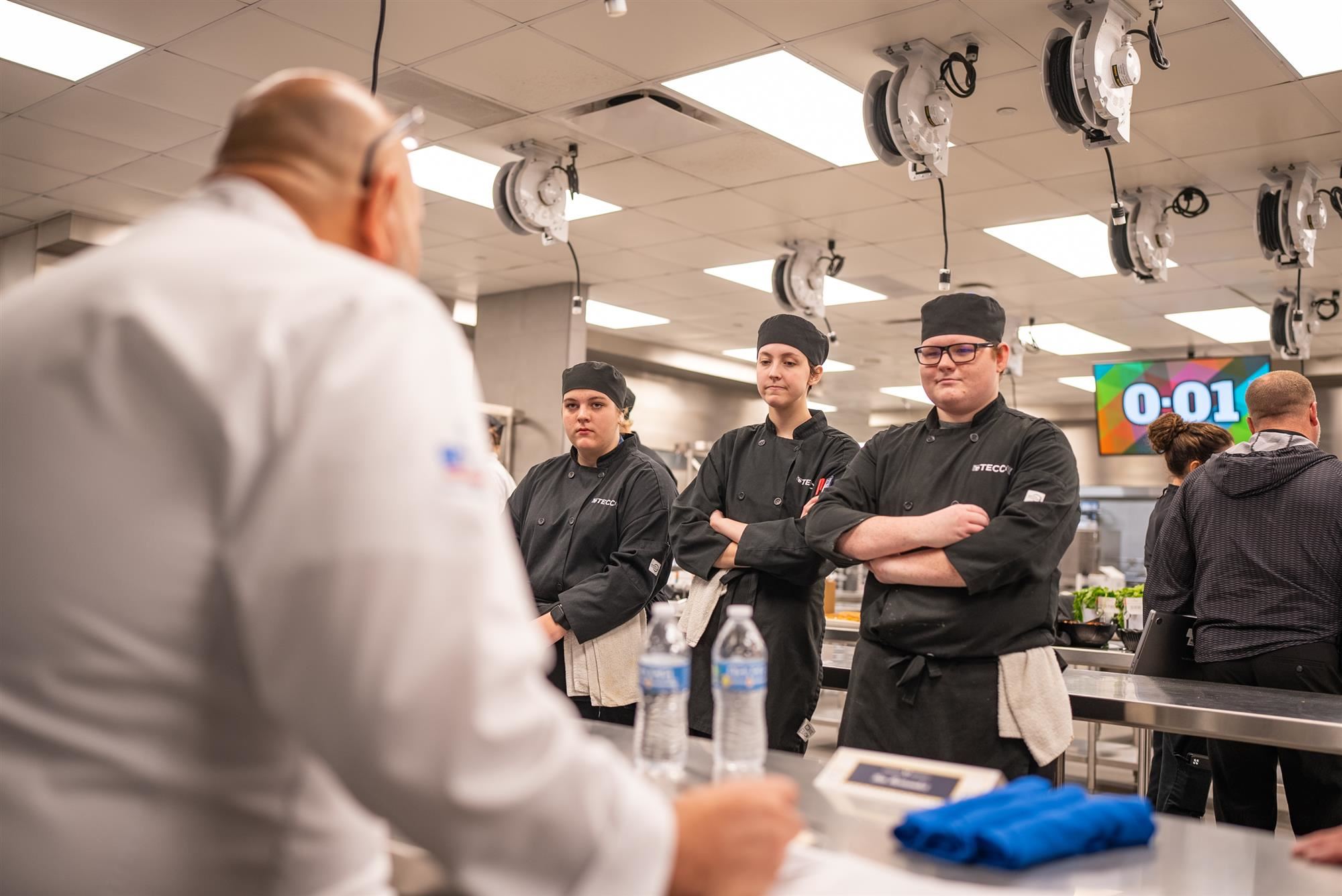 Cluck, Phillips and Collins have their dish critiqued by guest judge Ben Hernandez