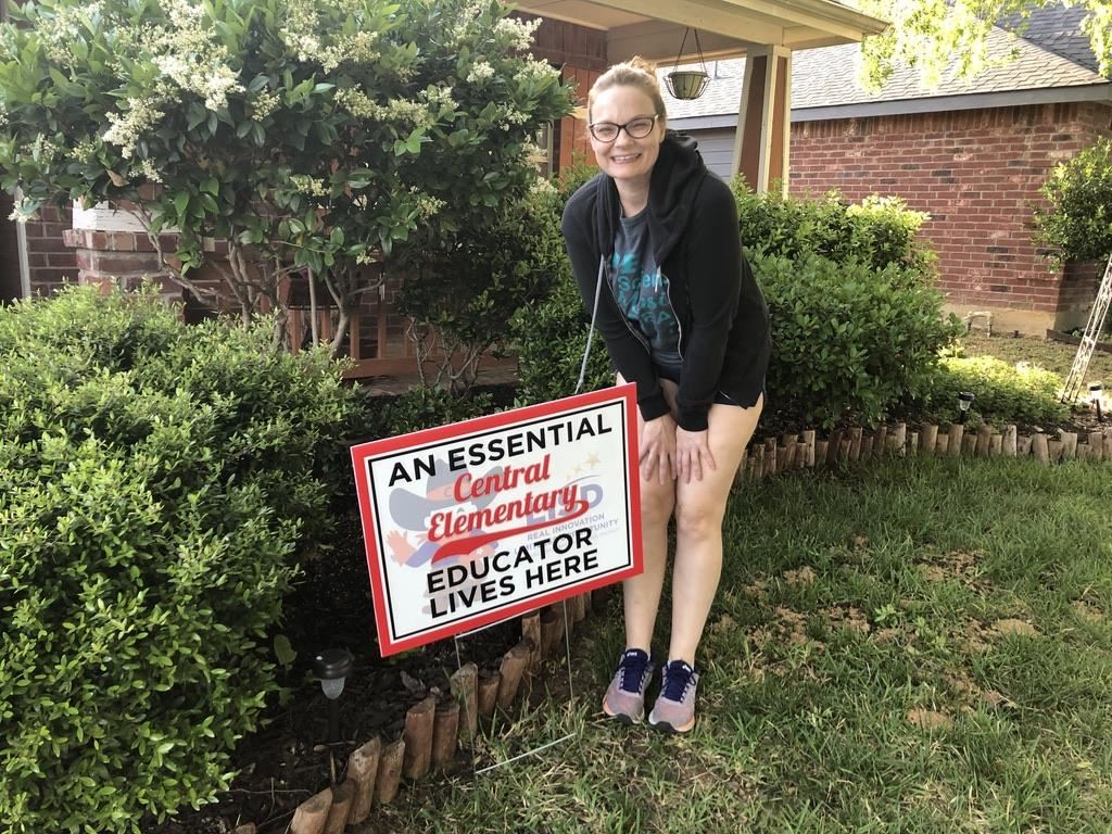 Central ES teacher receives a yard sign for Teacher Appreciation Week. 