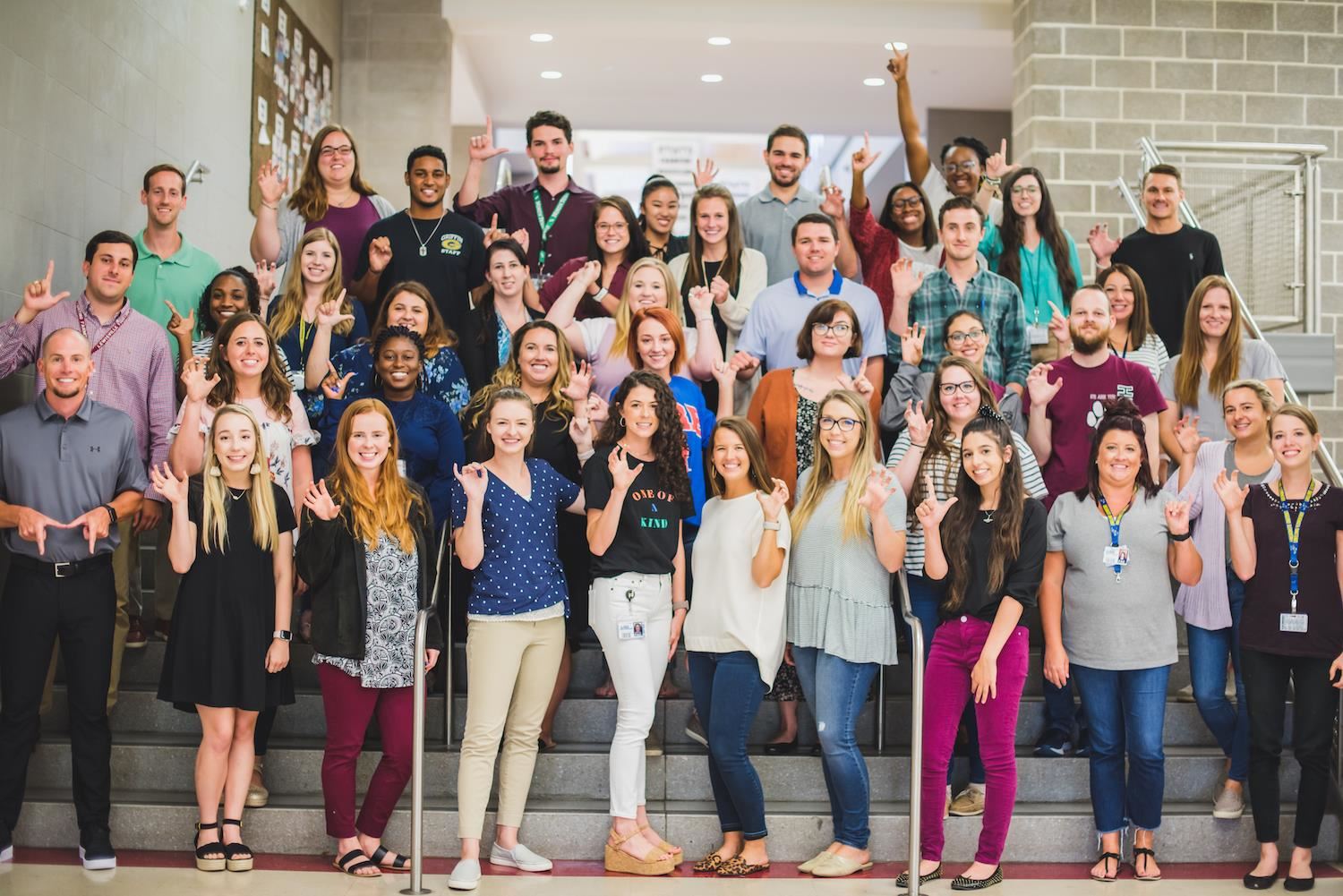 Group of Teachers Stand Together
