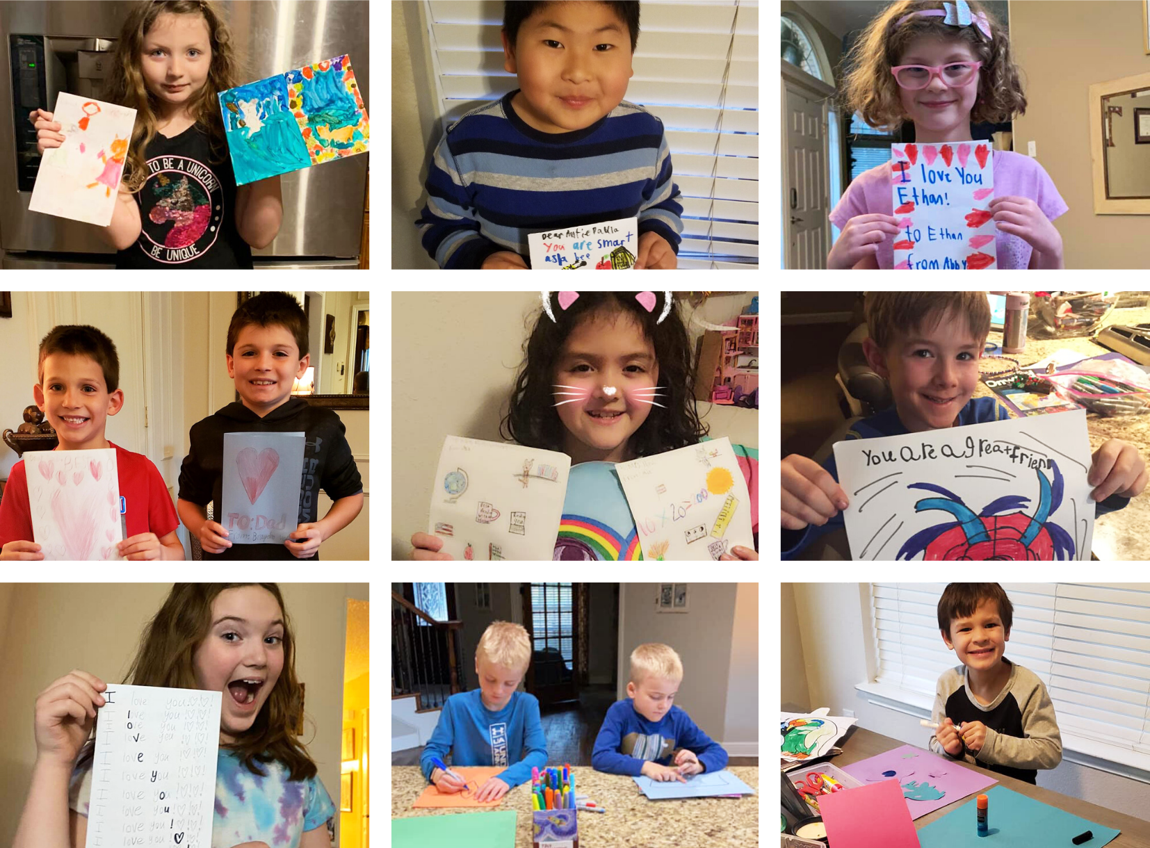 Students smile and pose with their homemade kindness cards 