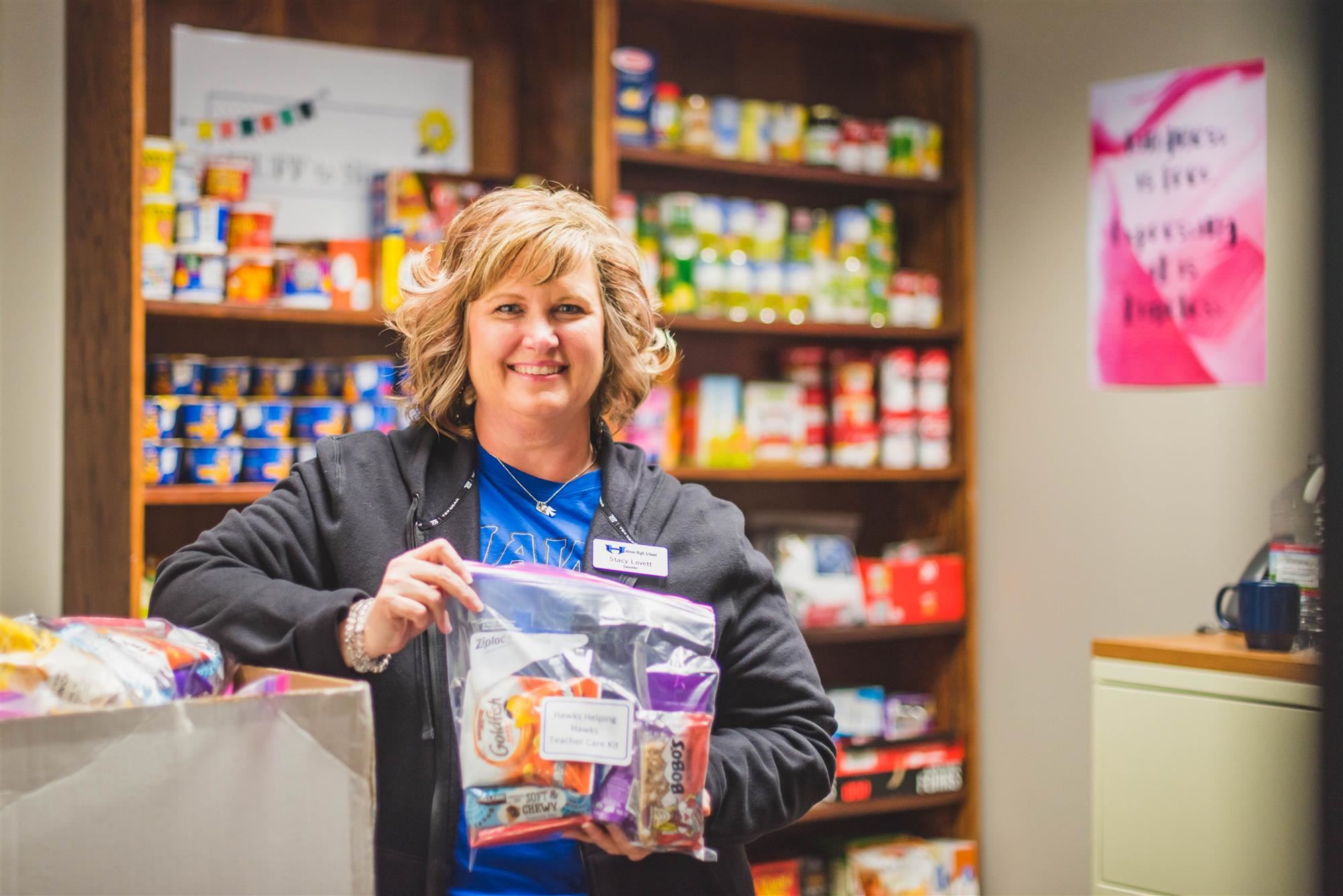 Counselor smiles in snack pantry 