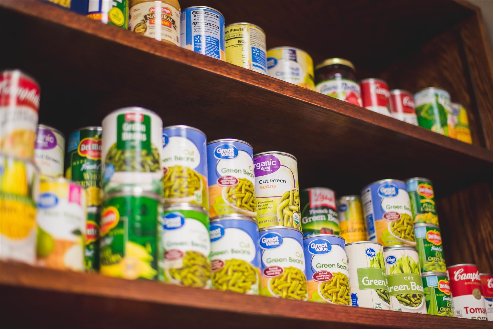 Canned foods on snack pantry shelf 