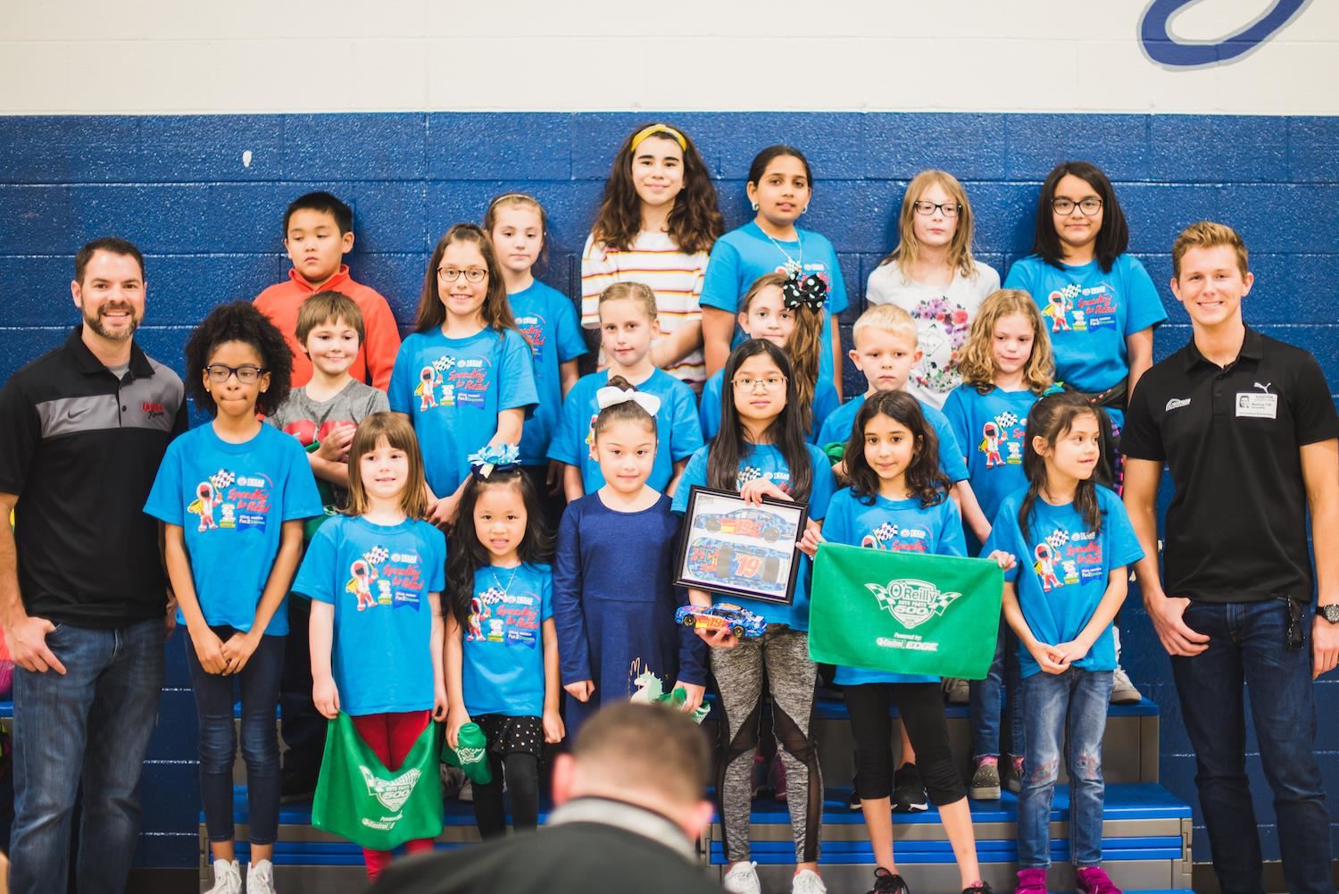 Top-reader students smile for group photo 