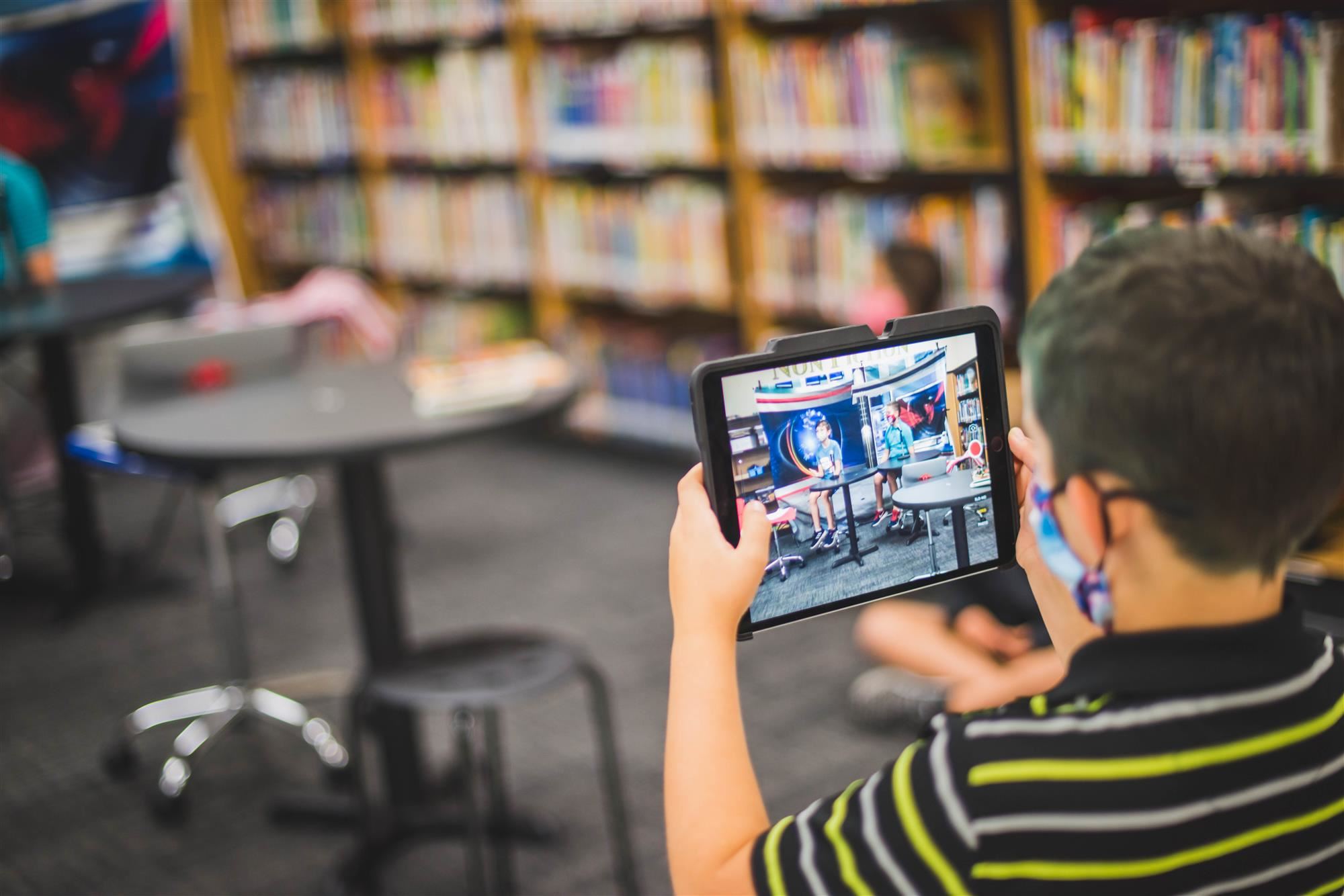 Student records morning show on ipad 