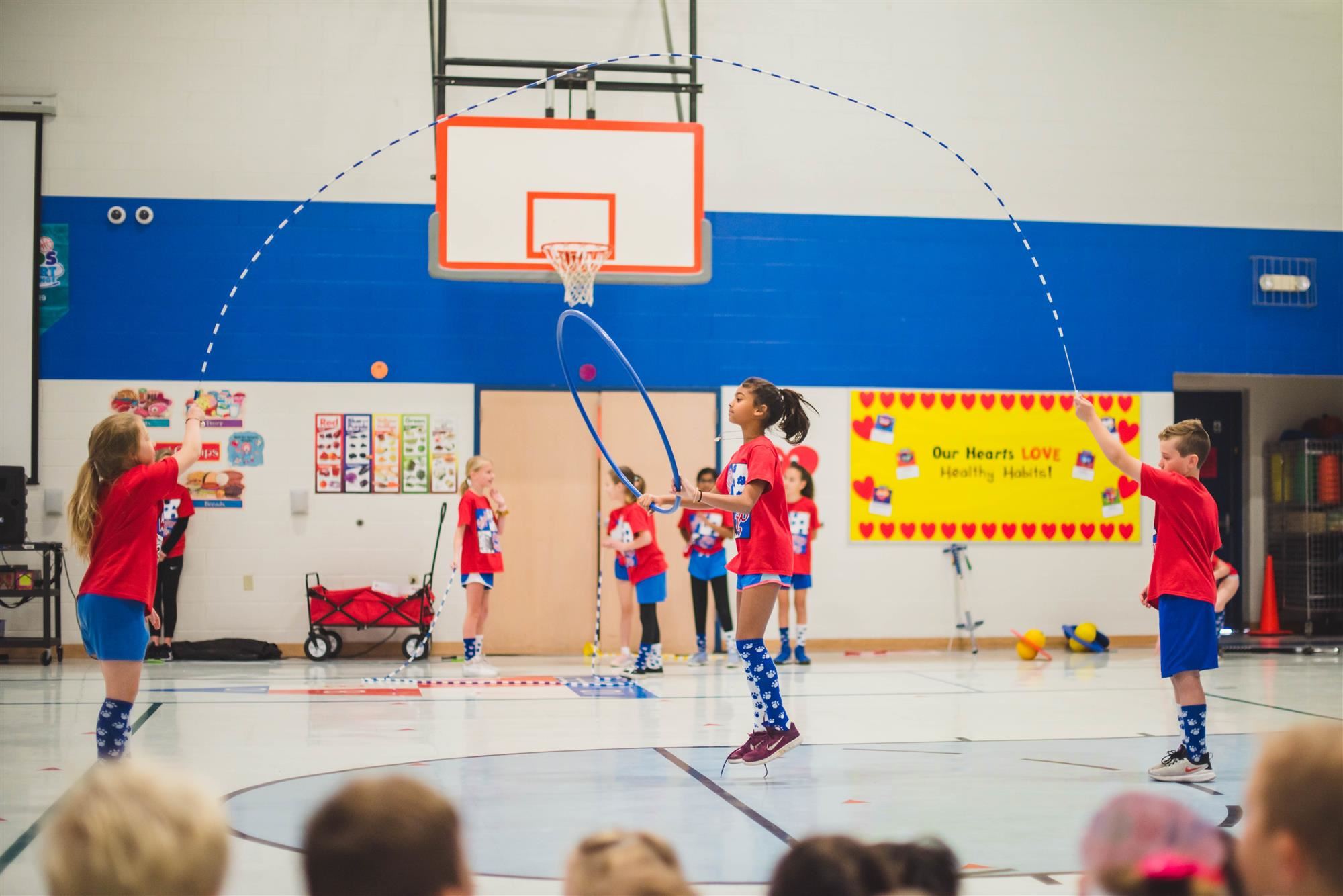 Jump rope team performs with hoola hoop 