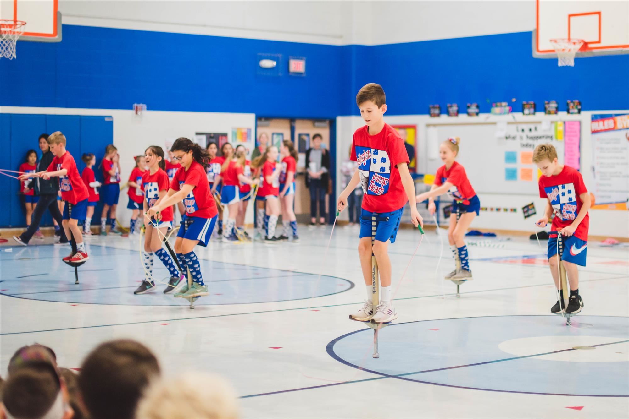 JUmp rope team performs with pogo sticks 