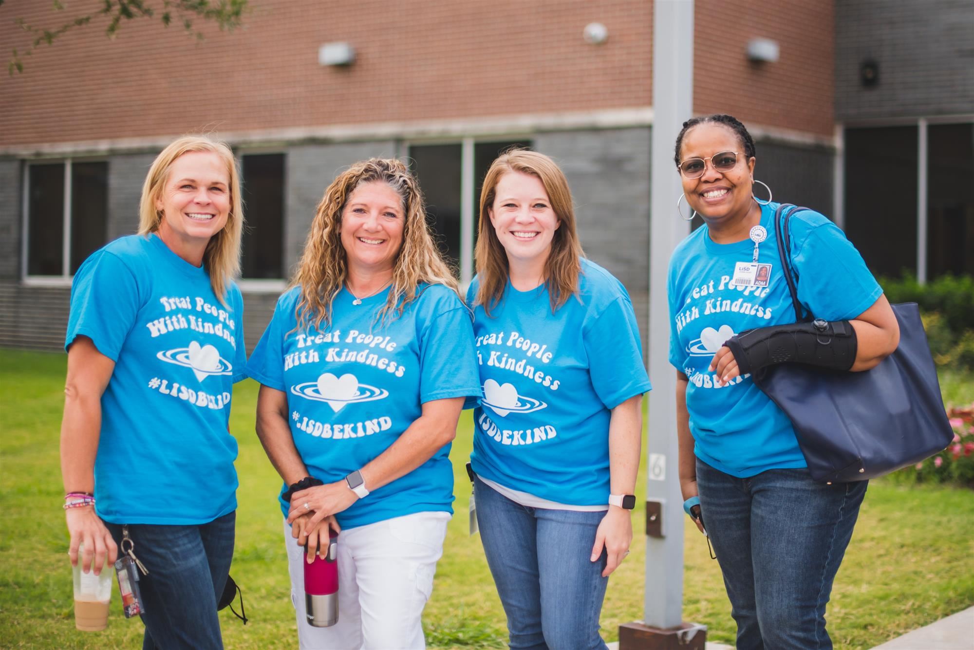 Teachers wear blue Kindness Week shirts