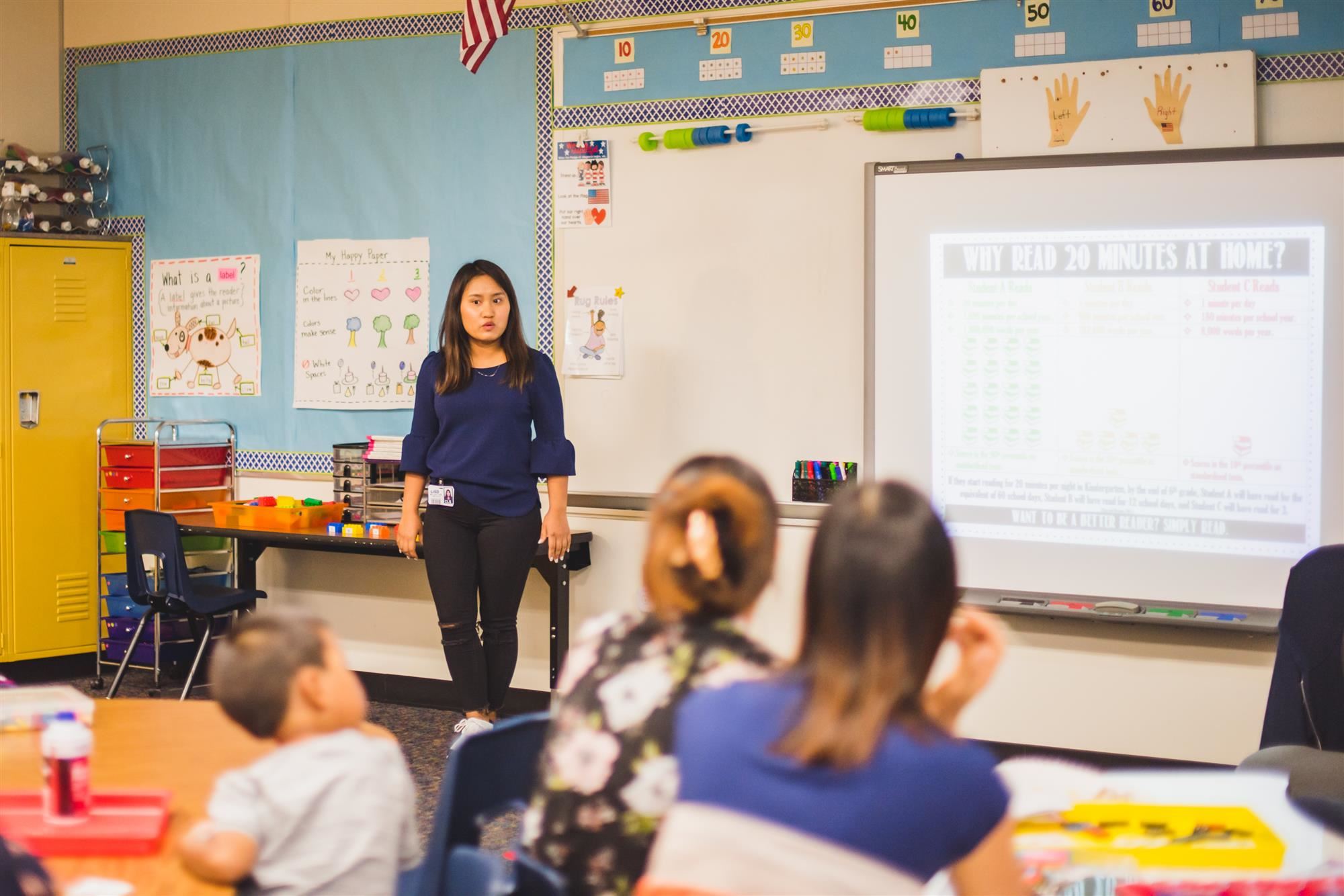 Chin interpreter speaks to crowd of parents and students. 