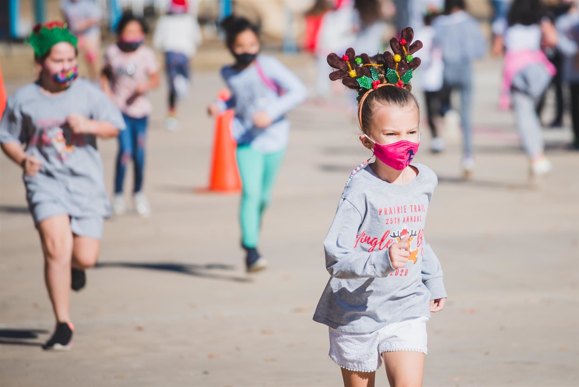 Students runs with antler headband 