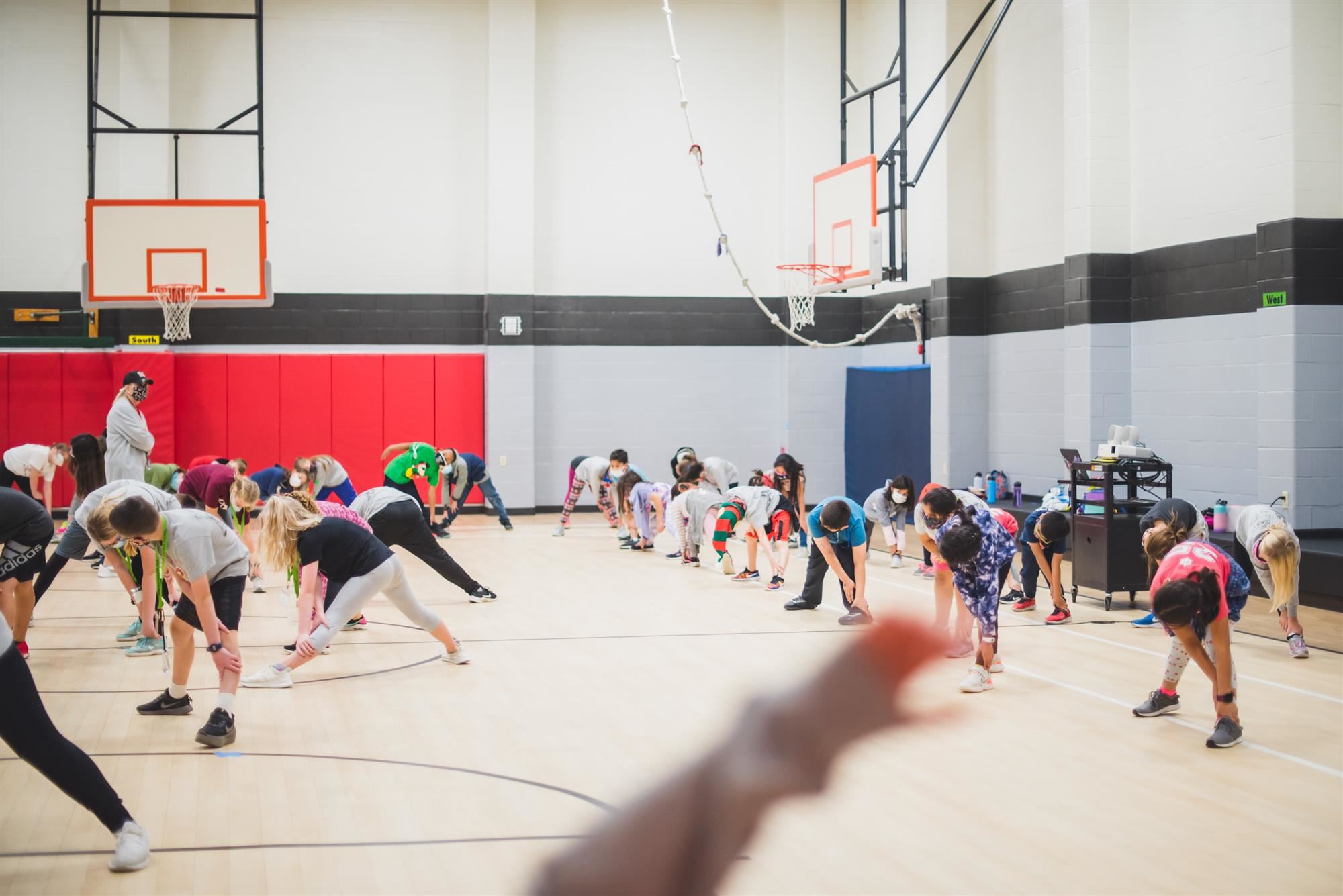 Students stretch before their run 