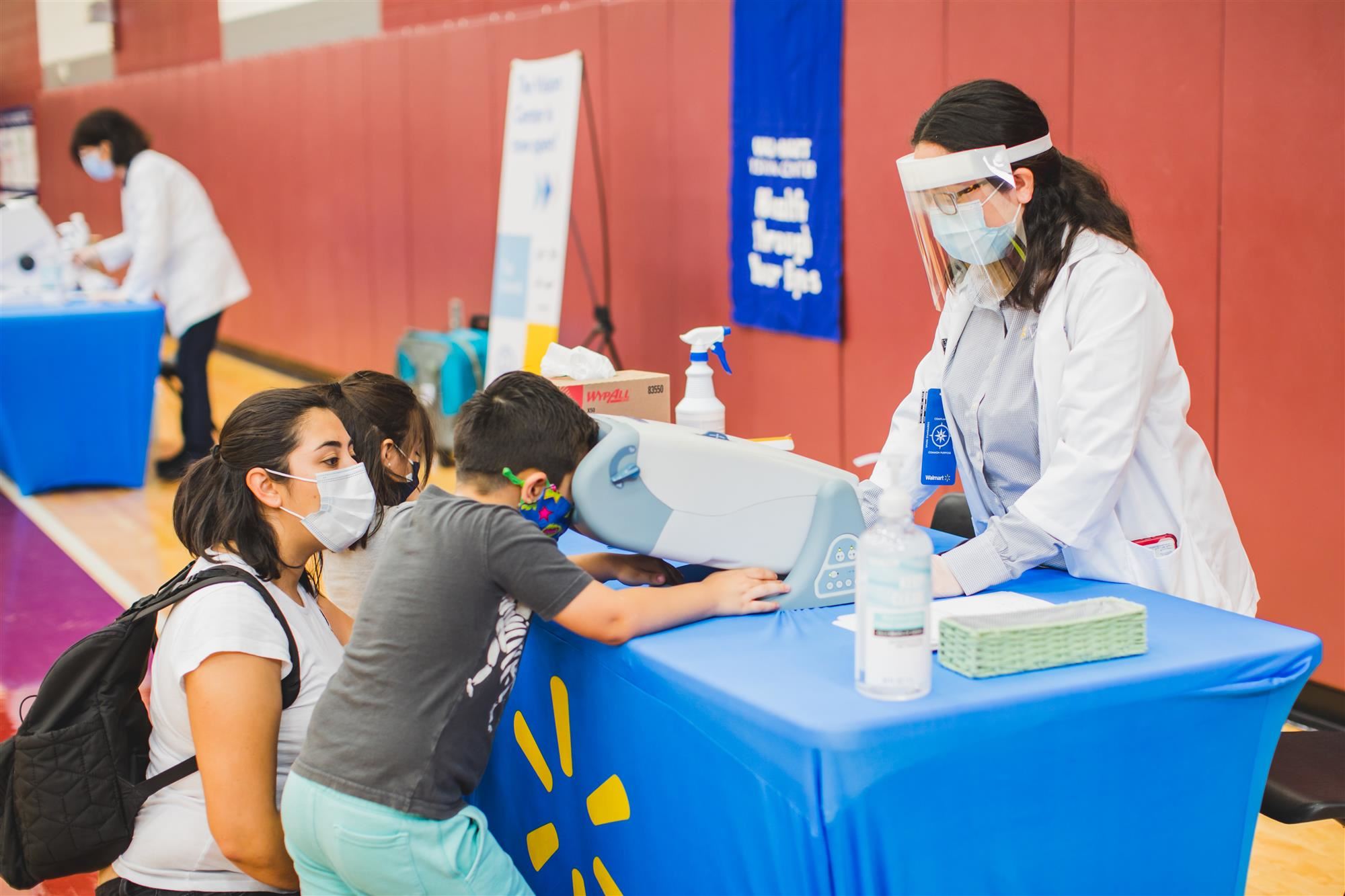 Child receives a vision screening at LISD's Health Fair. 2021