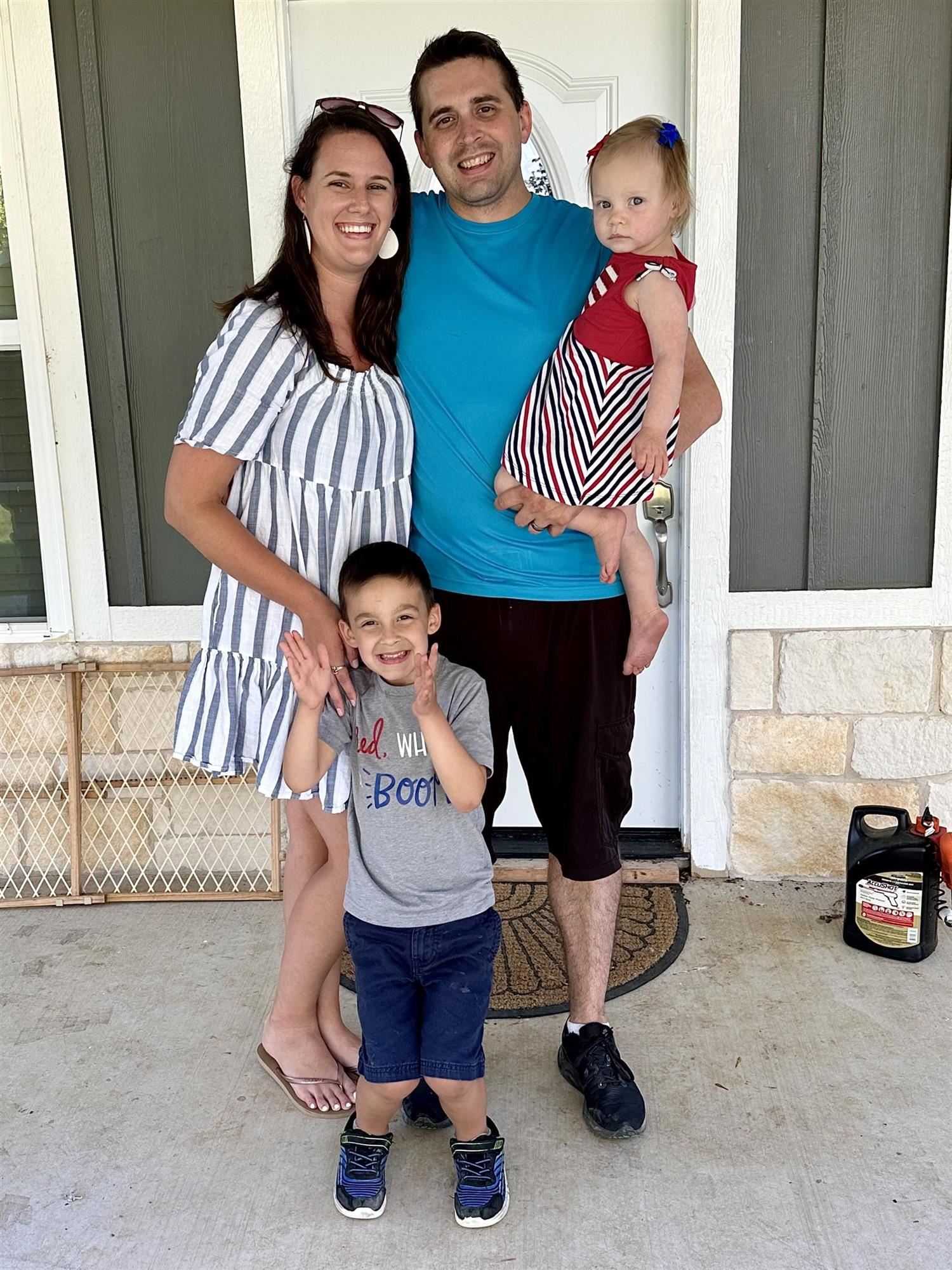 a family standing outside